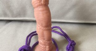 Tantus Bound silicone dildo with purple knotted rope