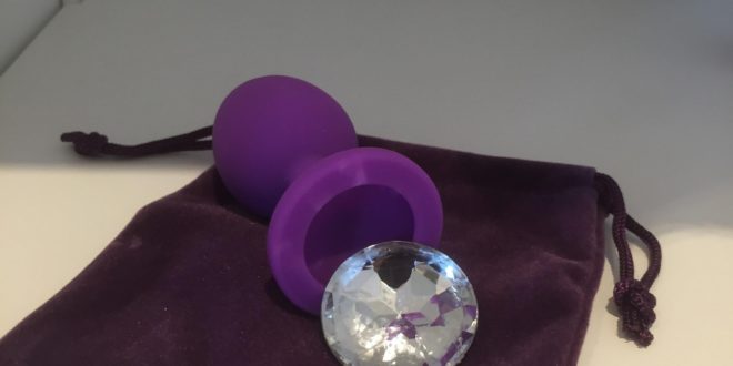 Purple silicone butt plug with faux crystal gem removed from the base. From the So Divine range of adult toys.