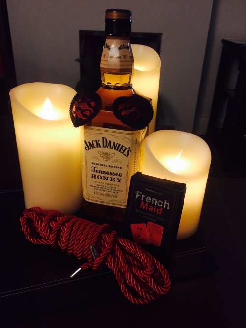 candles with Jack Daniels, nipple pasties and bondage rope