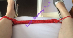 Red nylon rope spreader bar between Luv Bunny's ankles