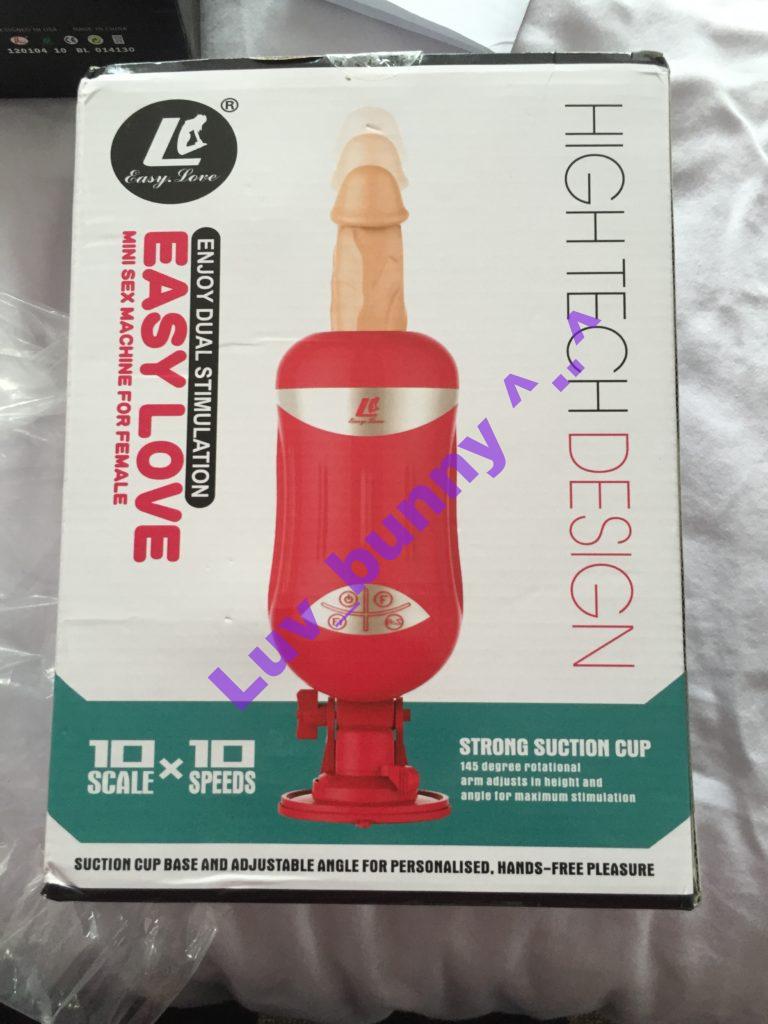 Packaging for Pink ABS plastic thrusting dildo machine with suction base and 6-inch silicone dildo