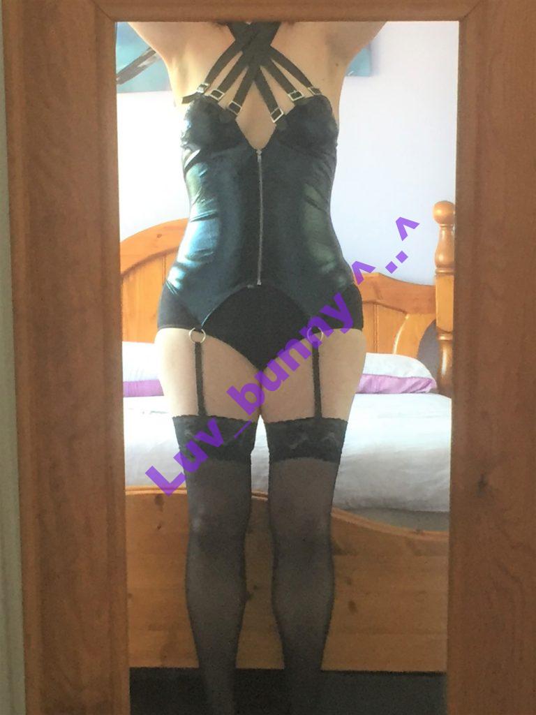 Front view of the Dreamgirl Wet-look zip front bustier with buckle choker. Worn by LuvbunnySL82 with hold-up stockings