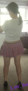 Luv bunny wearing sexy pink school skirt back view