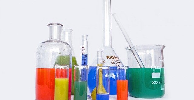 chemistry flasks with brightly coloured liquids