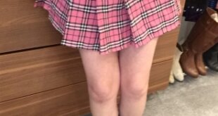 Luv Bunny wearing a pink checked pleated skirt