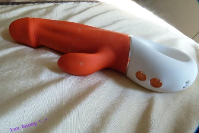Honey Sx G-wave vibrator (orange) close up