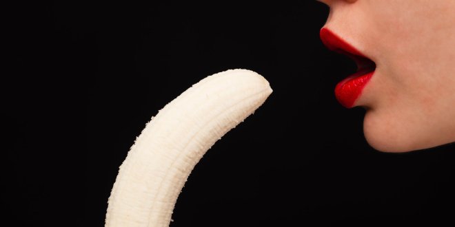 woman eating banana